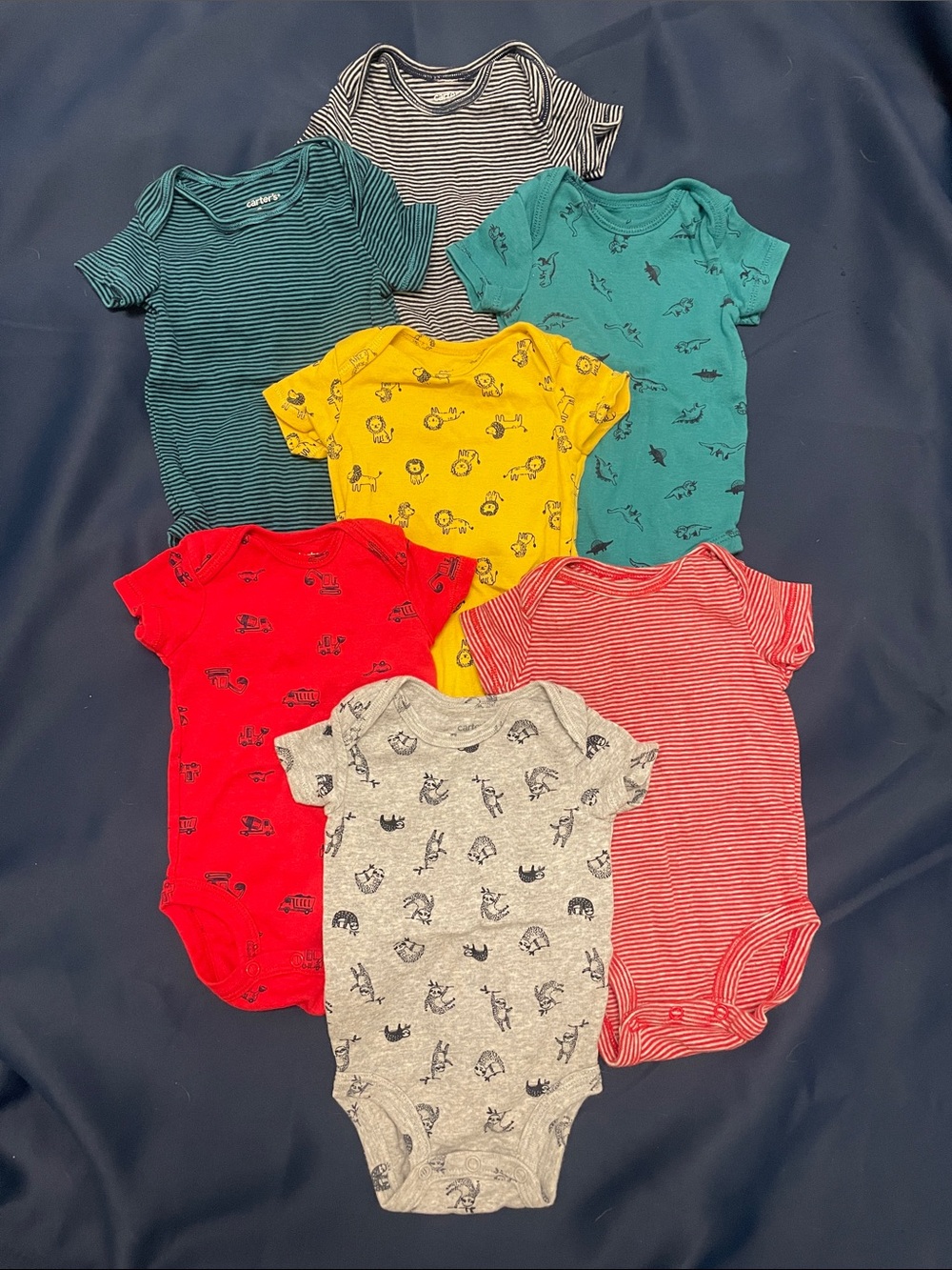 7 Carter’s onsies, 3 month